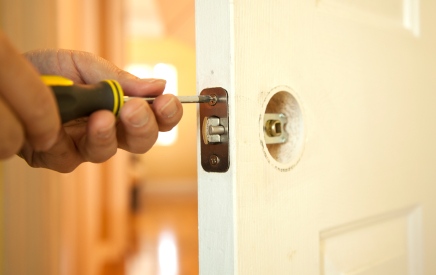 Handyman in Venice, CA fixing door.